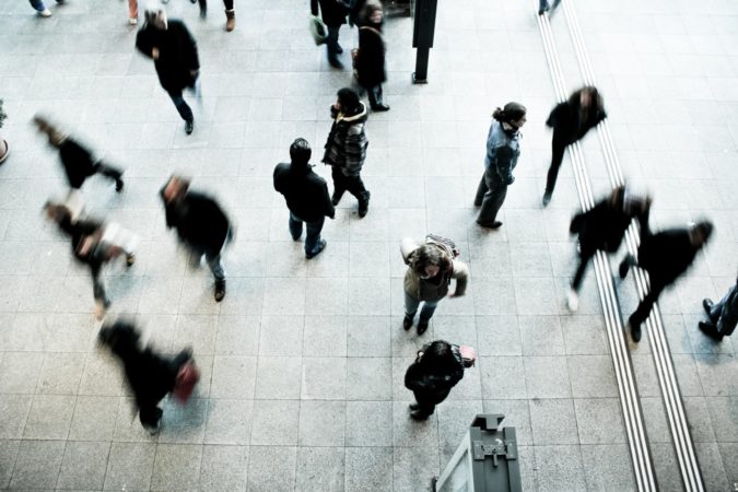 people walking on grey concrete floor
