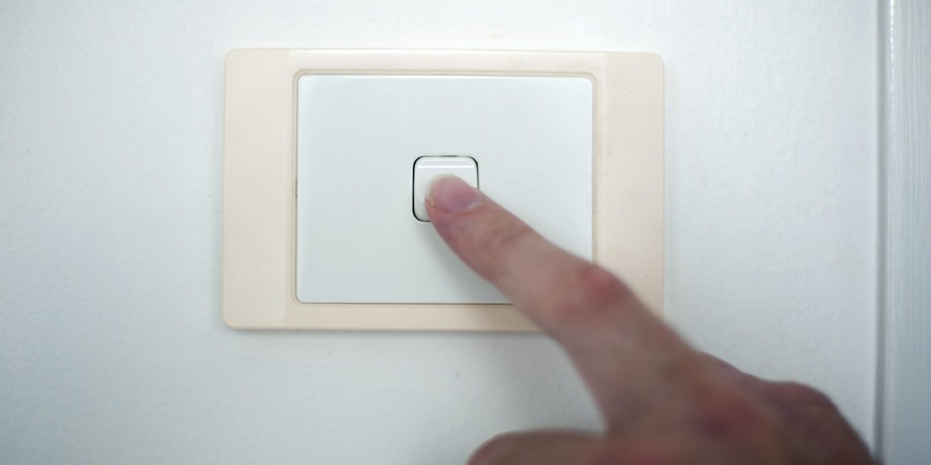 Finger switching on or off a light switch