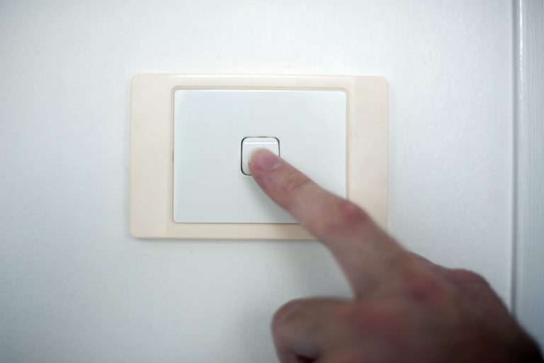 Finger switching on or off a light switch