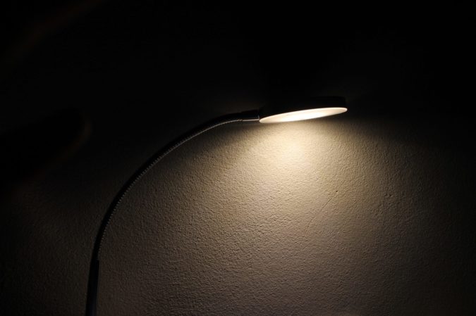 lamp illuminating a dark wall