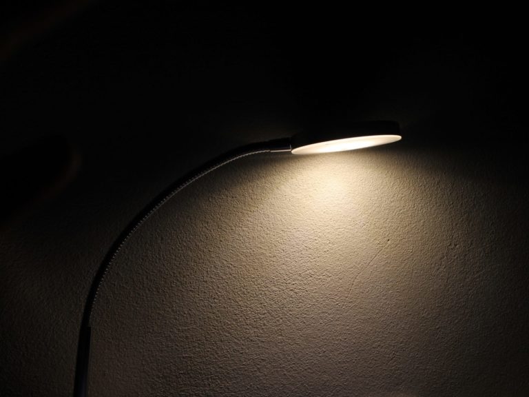 lamp illuminating a dark wall