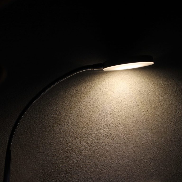 lamp illuminating a dark wall